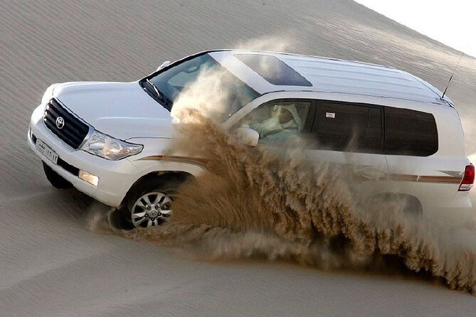 4hr Desert Safari: Sunset,Sunrise,Camel,Sand boarding,Inland Sea - Sandboarding from the highest dunes