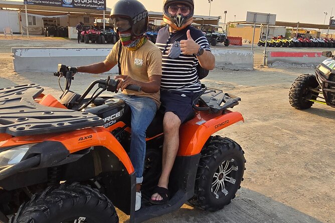 Desert Safari, Quad Bike, Sandboarding and Camel Ride - Sandboarding on the dunes
