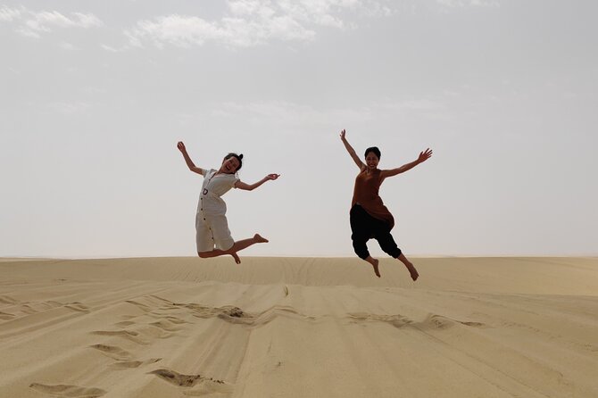 Desert Safari with Sandboarding and Inland Sea Private Tour - Sandboarding on the soft dunes