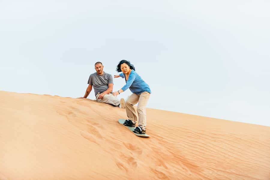 Doha: Desert Safari Dune Bashing, Sandboarding, & Camel Ride - Sandboarding and high-dune photo stops