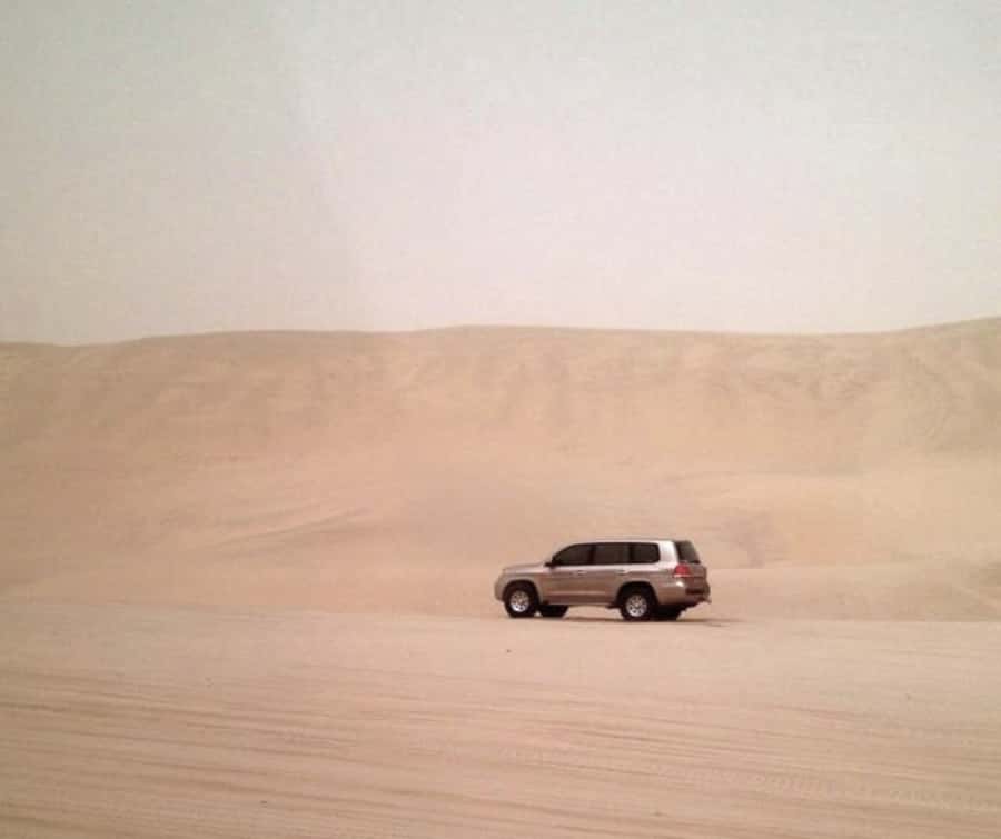 Doha Desert Safari: Sandboarding, Camel Ride & Swimming Fun - Leaving Doha in an air-conditioned 4x4