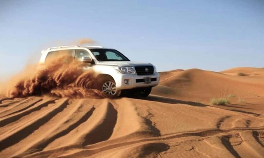 Doha Desert Safari: Sandboarding, Camel Ride & Swimming Fun - Drinks are covered, but meals are not