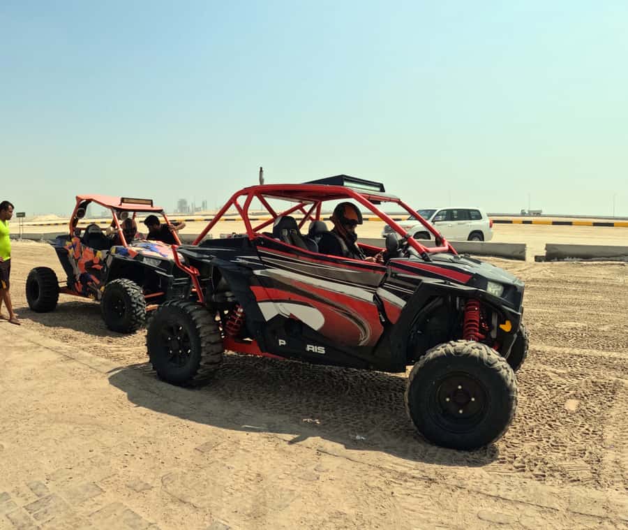 Doha: Desert Safari with Camel Ride and Quad Bike and Buggy - Sand boarding turns the dunes into a playground