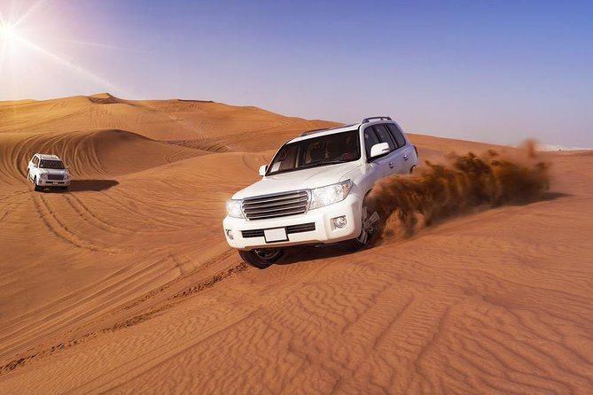 Doha: Desert Safari With Quad bike ,Camel Ride And Sand Boarding - Sunrise, red dunes, and a fast start from Doha
