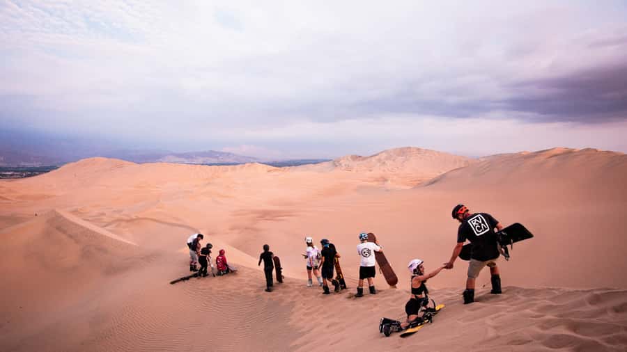 Doha: Dune Bashing Safari, Falcon, Camel, ATV, Sandboarding - Dune bashing on Qatar’s high sand ridges