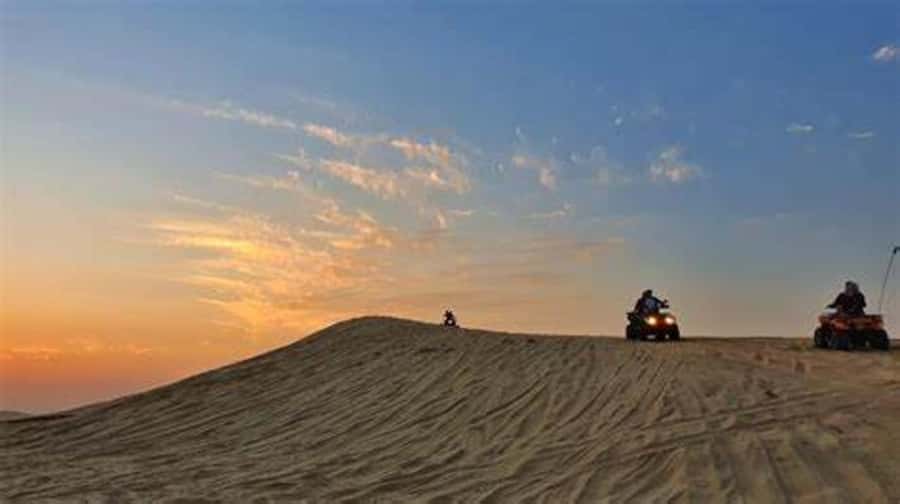 Doha: Full-Day Desert Safari, Dune Bashing & BBQ Dinner - Photo time and sandboarding at Sealine