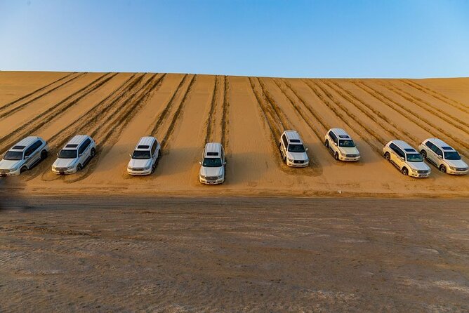 Doha Half Day Desert Safari Dune Bashing CamelRide & Sandboarding - Sandboarding on soft desert slopes