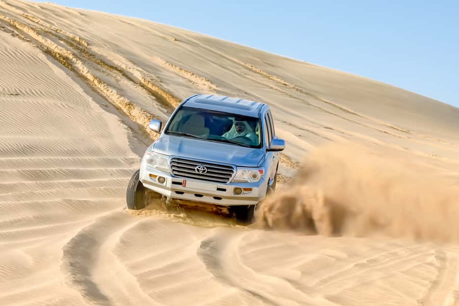 Doha: Half-Day Desert Safari, Quad Bike, Camels & Inland Sea - Sandboarding, with a climb back up