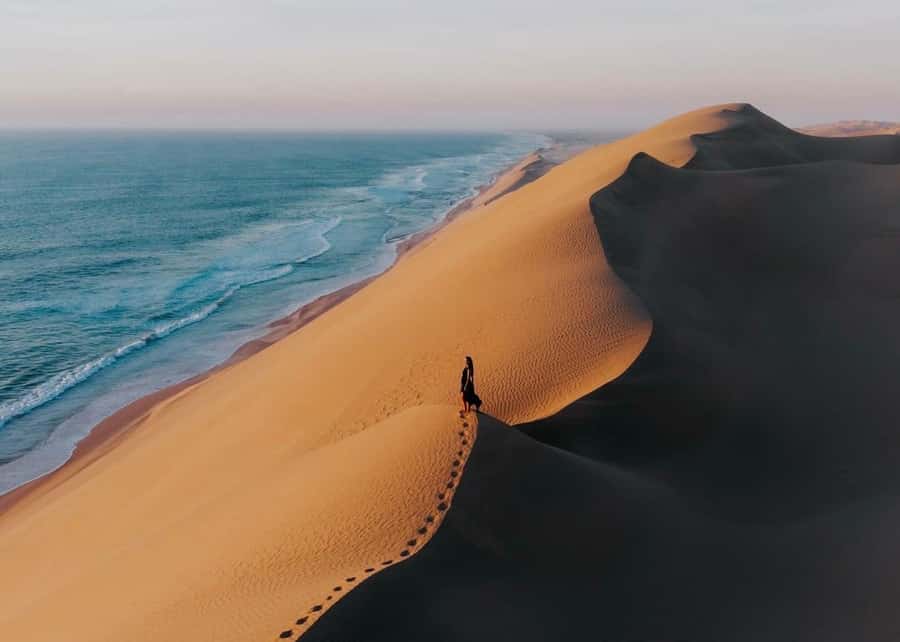 Doha: Inland Sea Desert Safari with Sunset & Sunrise Views - Tea, photographs, and the road to Sealine Beach