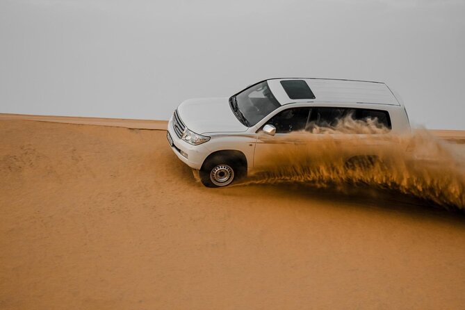 Doha Qatar ATV Quad Bike Buggy Desert Adventure and Camel Ride - Sealine Beach, dune bashing, and sandboarding