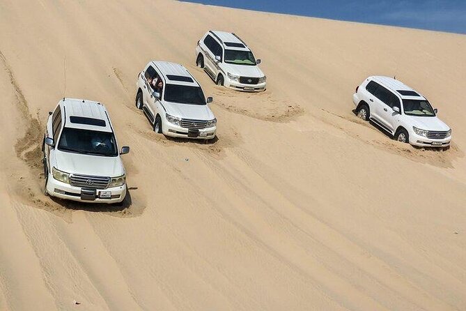 Doha Qatar ATV Quad Bike Buggy Desert Adventure and Camel Ride - The Inland Sea is the visual payoff