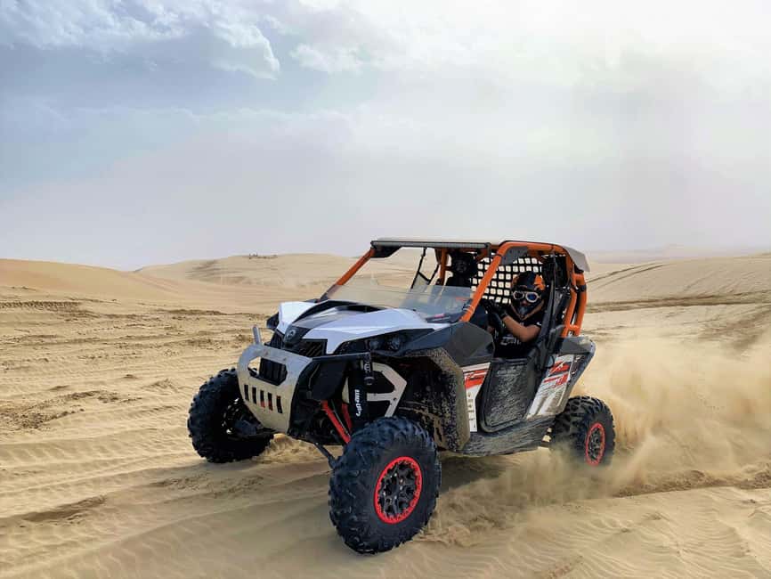 Doha Qatar Buggy ride, camel ride, dune bashing, sandboard. - A desert sampler with real driving time