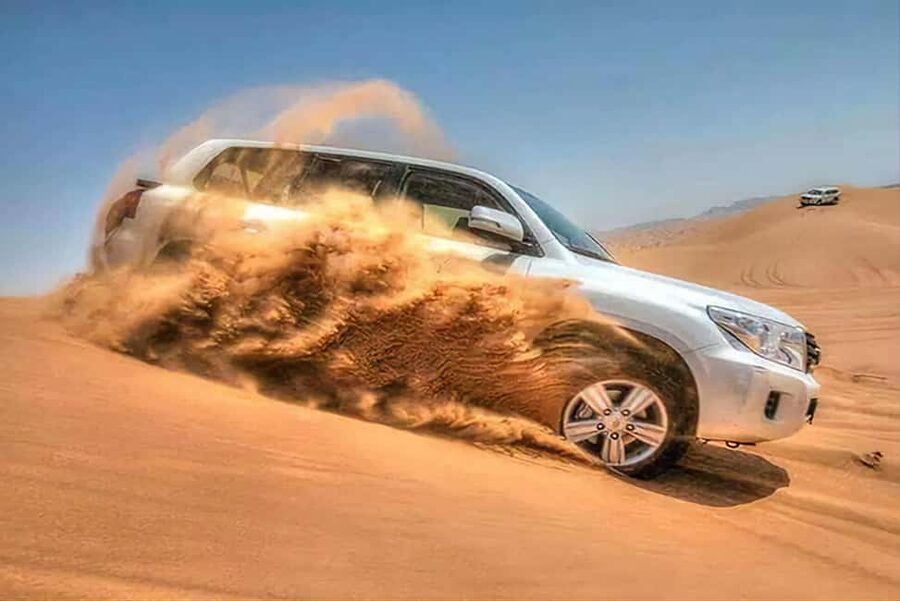 Doha Qatar : sealine adventure Camel Ride sandboard Sunset - Dune bashing on the way south