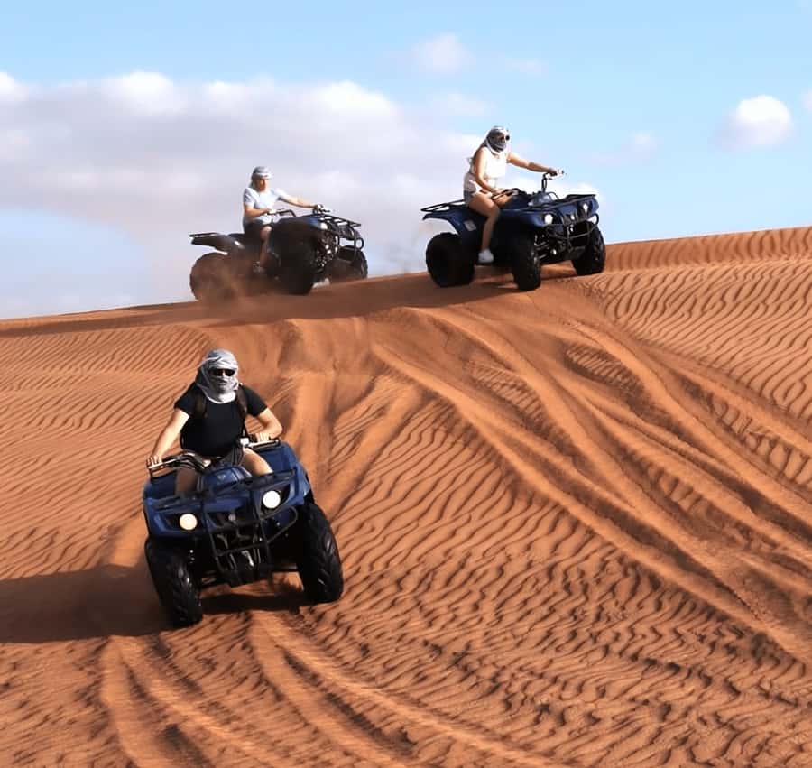 Doha Safari: ATV Ride, Dune Bashing, & Sandboarding Fun - Dune bashing across the southern dunes