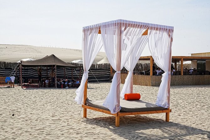 Private Full Day Desert Safari Dinner and Camel Ride in Doha - Sandboarding adds a hands-on desert stop
