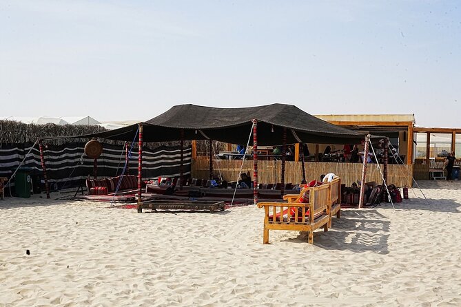 Private Full Day Desert Safari Dinner and Camel Ride in Doha - Photo time from the top of a dune