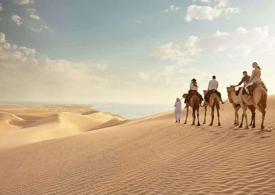 Qatar: ATV & Quad Dune Bashing, Camel Ride, & Sandboarding - ATV riding across the golden dunes