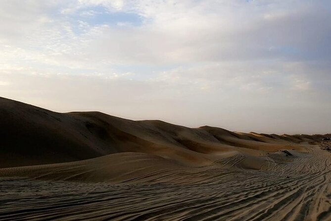 Qatar Sunset Desert Safari: Dune Bashing & Golden Sands Adventure - Sandboarding on Qatar’s dunes